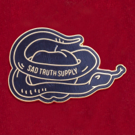Дизайнерский значок "Змей-искуситель" от Sad Truth Supply