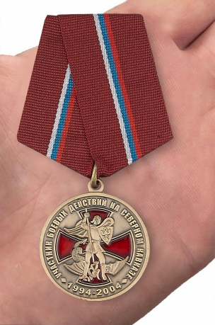 Памятная медаль Участник боевых действий на Северном Кавказе - вид на ладони
