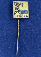 Значок на иголке Stucka